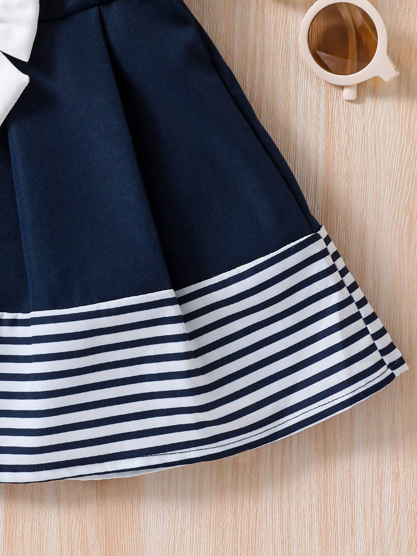Prenda azul marino vestido para bebe con detalle de franjas en el acabado
