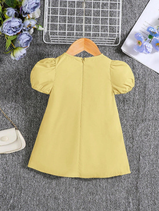 Vestido amarillo con lazos y manga farol