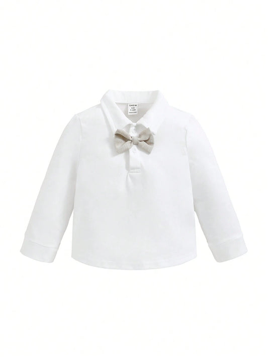 Camisa blanca de manga larga para bebé con moño beige, vista frontal