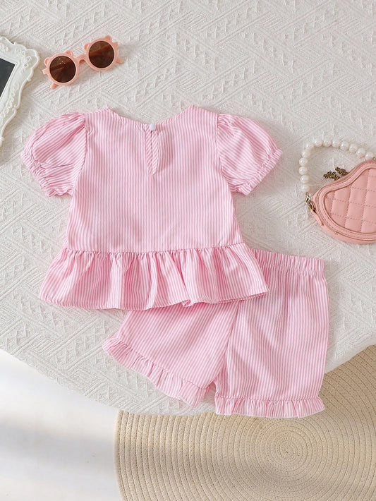 Set rosa con moños y shorts con volantes