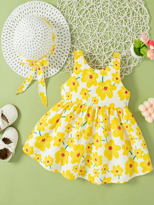 Prenda amarilla vestido para bebe con flores y lazo con sombrero vista trasera