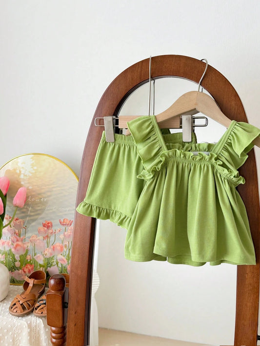 Prenda verde conjunto para bebe con flores bordadas y short vista trasera