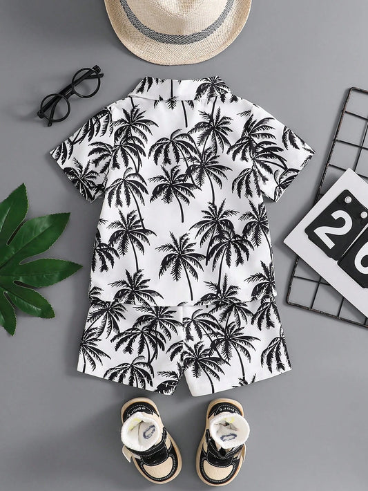 Prenda blanco negro conjunto tropical para bebe con estampado de palmeras vista trasera