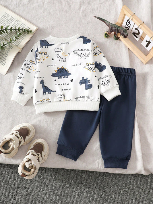 Prenda blanca conjunto para bebe con dinosaurios y pantalón azul marino vista trasera