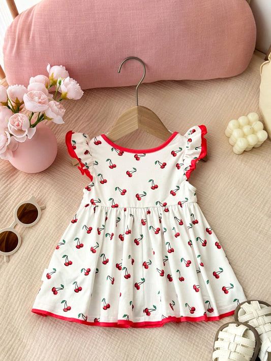 Prenda blanco vestido para bebe con estampado de cerezas vista trasera