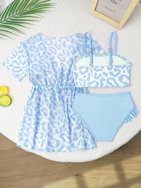 Prenda azul traje de baño para bebe de 3 piezas con salida estampada vista trasera
