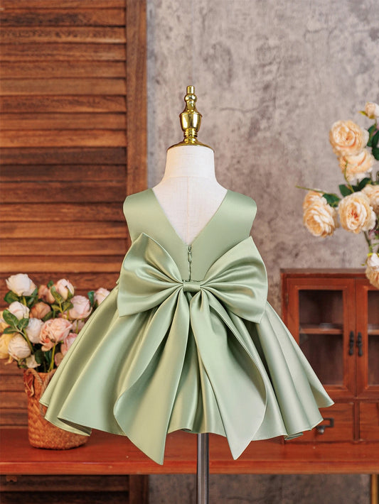 Prenda verde vestido para bebe con gran lazo en espalda vista trasera