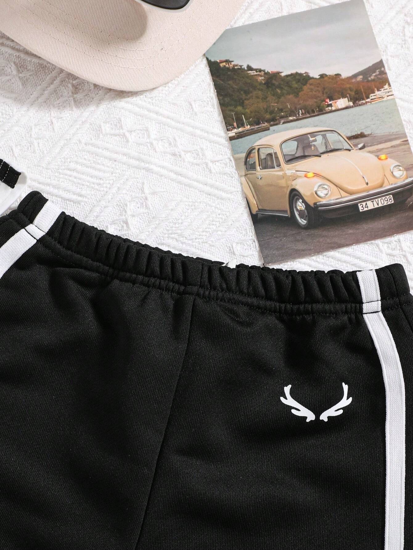 Prenda blanco y negro conjunto para bebe vista superior con accesorios