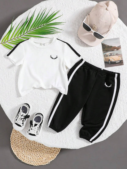 Prenda blanco y negro conjunto para bebe vista completa con camiseta y pantalón