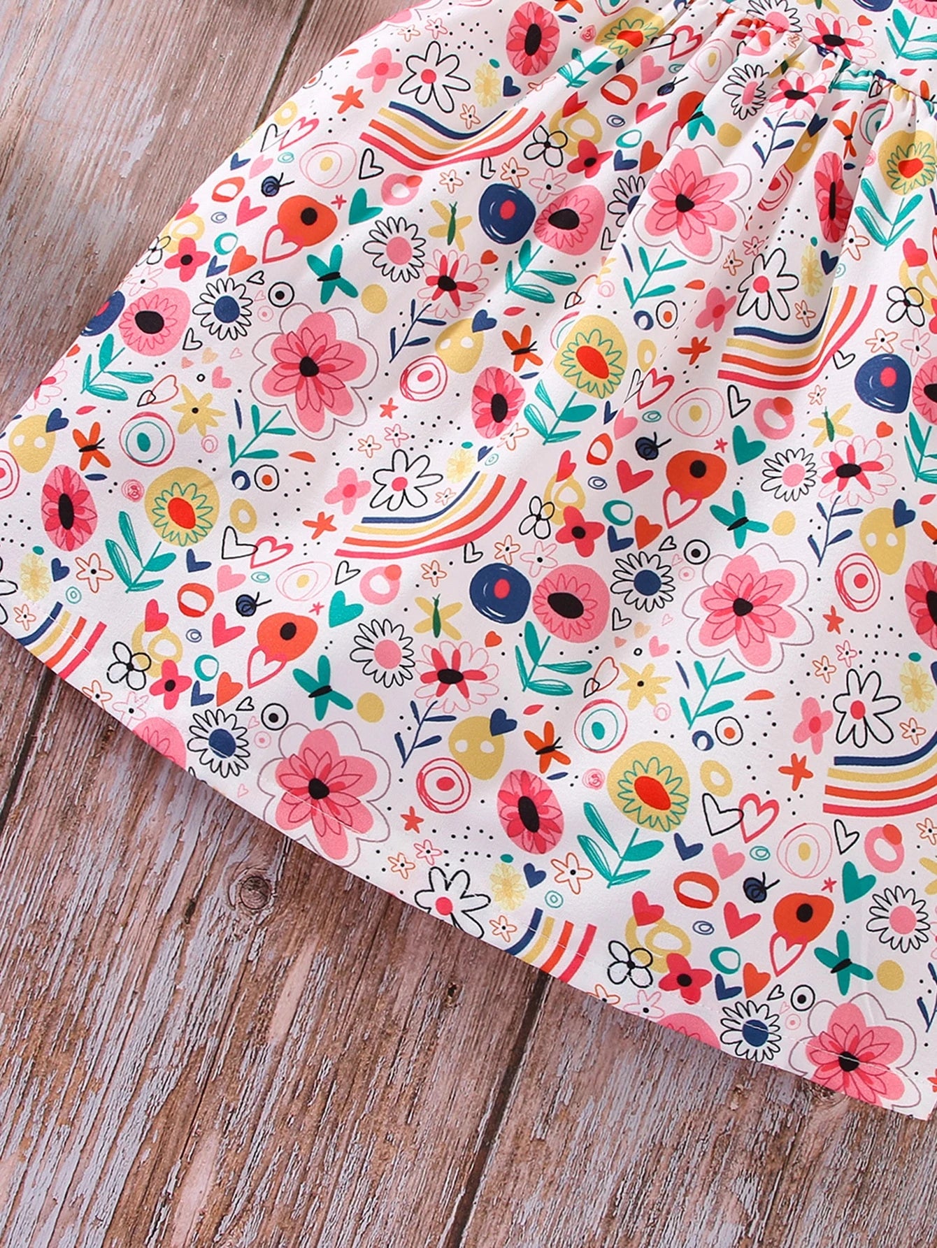 Vestido multicolor de niña sin mangas estampado floral