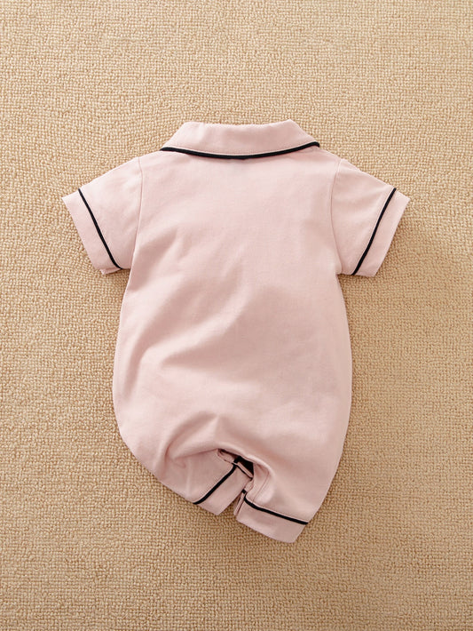 Prenda rosa pálido pijama para bebe niña con botones vista trasera