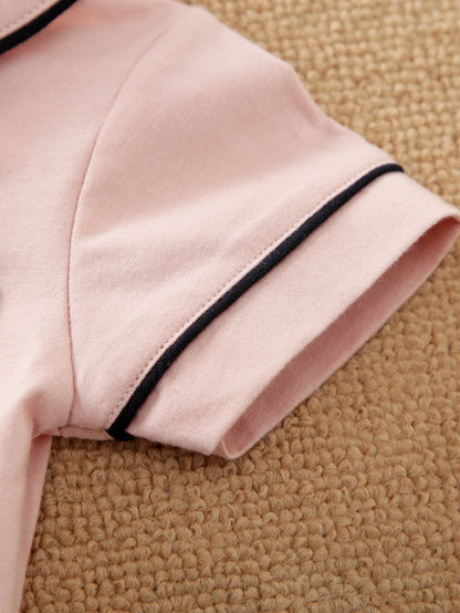 Prenda rosa pálido pijama para bebe niña detalle ribete manga