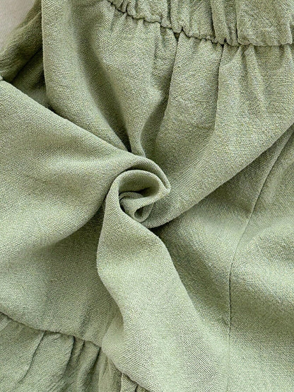 Enterizo verde menta con tirantes y cinturón para bebé niña