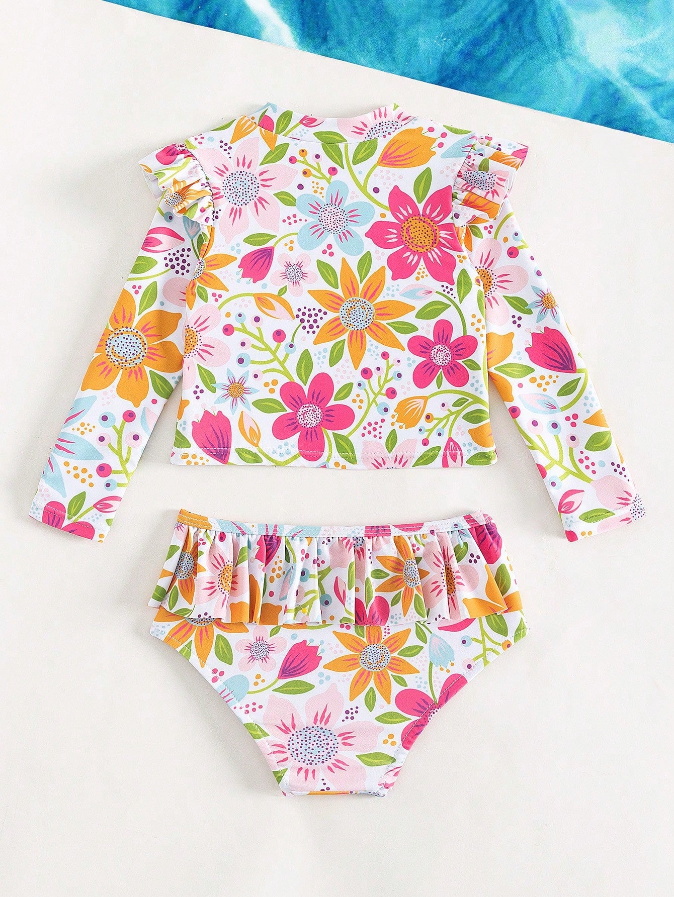 Prenda multicolor traje de baño floral para bebe vista trasera