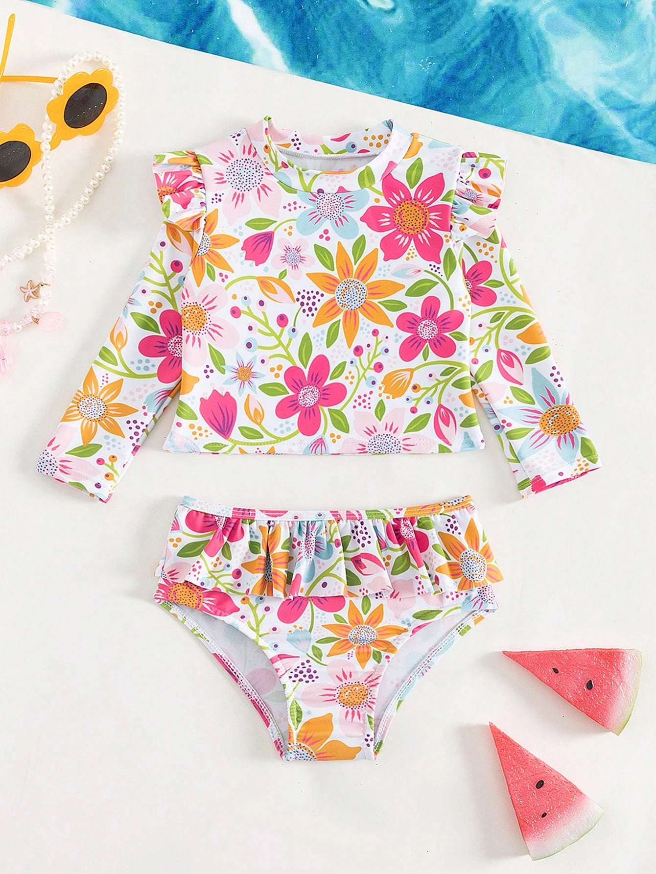 Prenda multicolor traje de baño floral para bebe vista frontal
