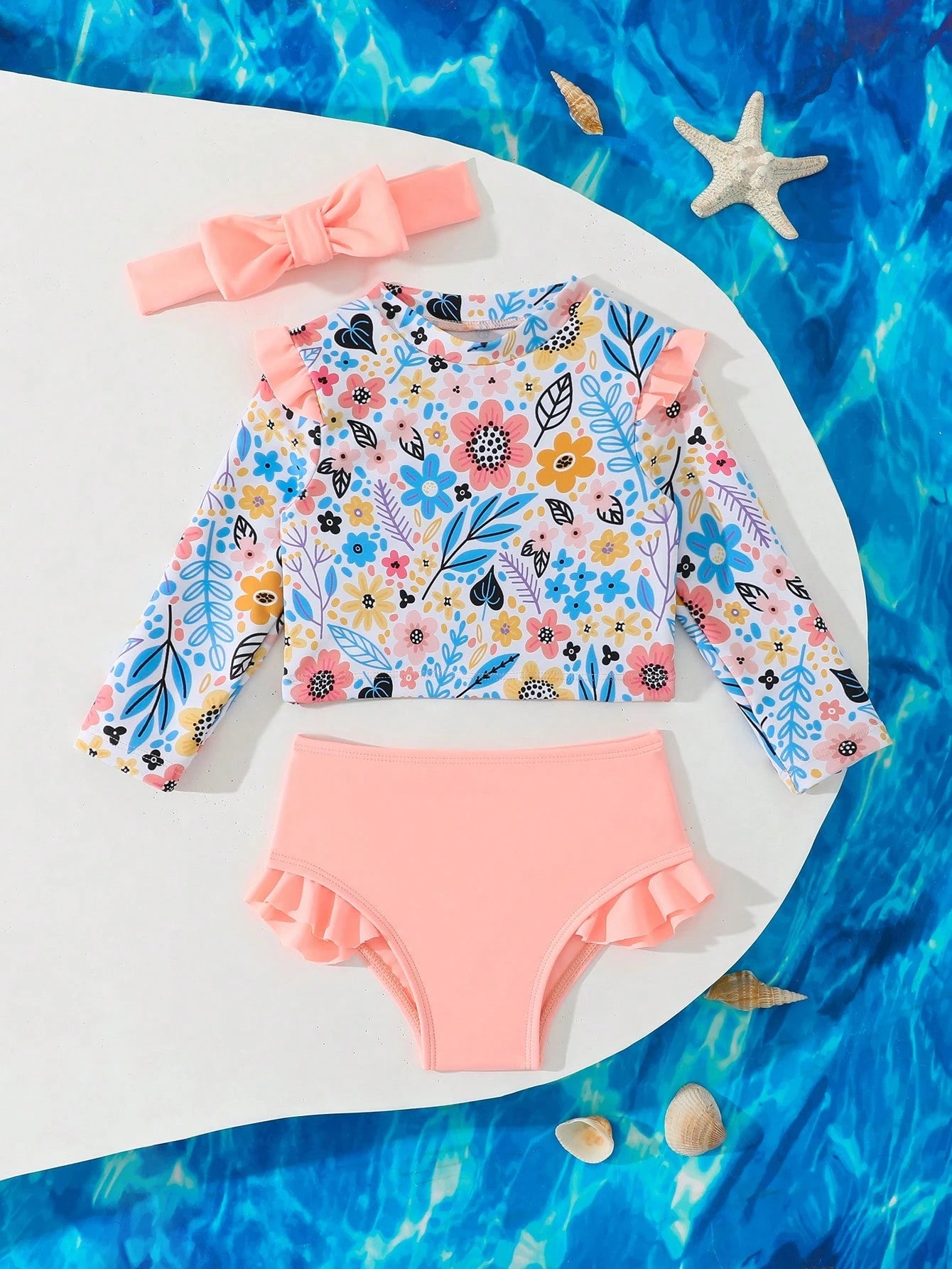 Prenda albaricoque traje de baño floral para bebe con diadema vista frontal