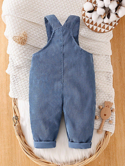 Prenda azul overol para bebe vista trasera con tirantes cruzados