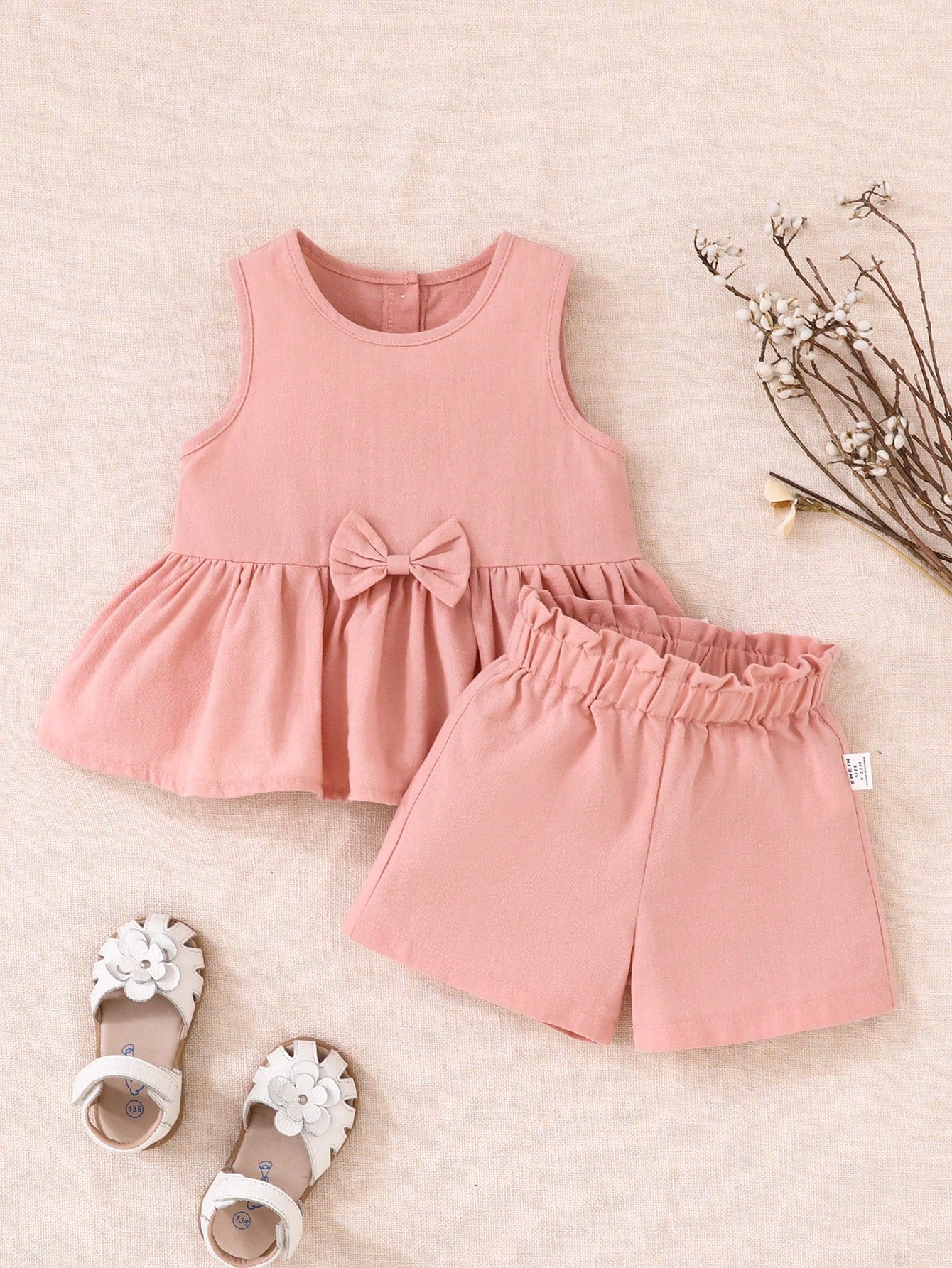 Conjunto rosa elegante con lazo para bebé niña