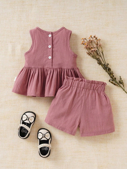Prenda rosa conjunto para bebe con blusa de lazo y short vista trasera