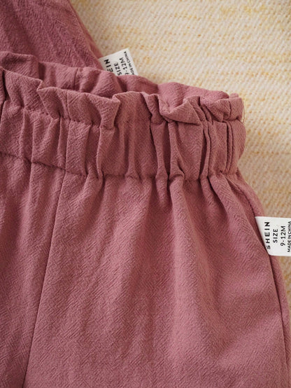 Prenda rosa conjunto para bebe detalle de cintura elástica con volante