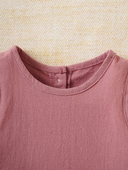 Prenda rosa conjunto para bebe detalle de cuello redondo y acabado de tela