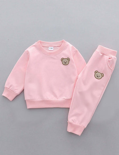 Prenda rosa conjunto para bebe con sudadera y pantalón con oso vista frontal