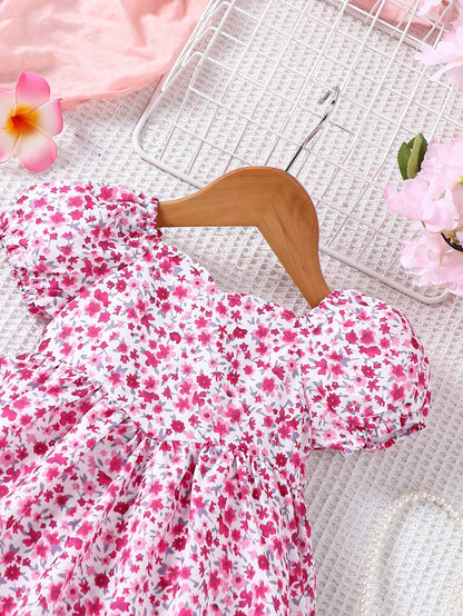 Prenda rosa vestido para bebe detalle de mangas abullonadas
