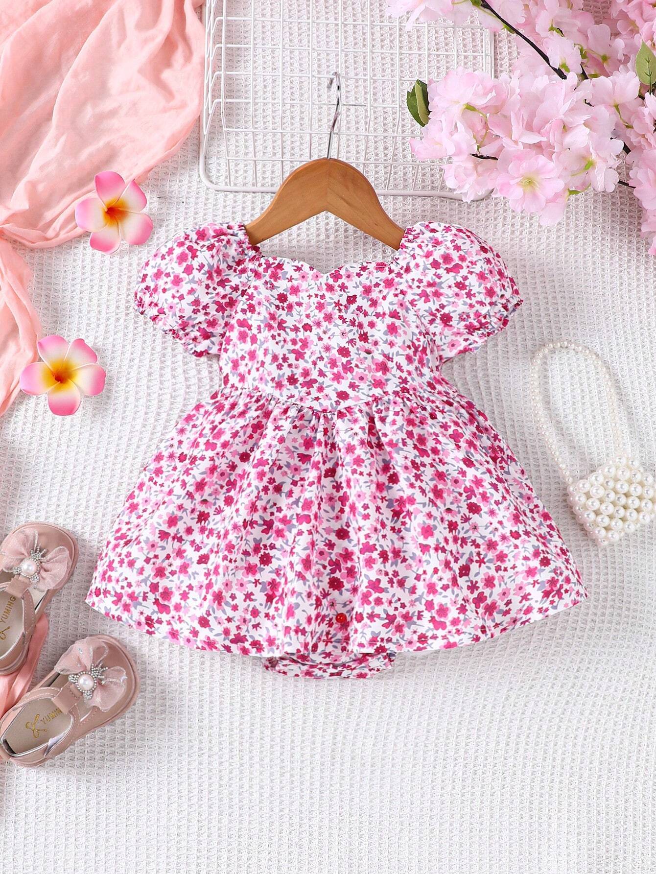 Prenda rosa vestido para bebe con estampado floral vista frontal
