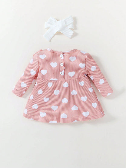 Vestido rosa corazones con lazo dulce acanalado