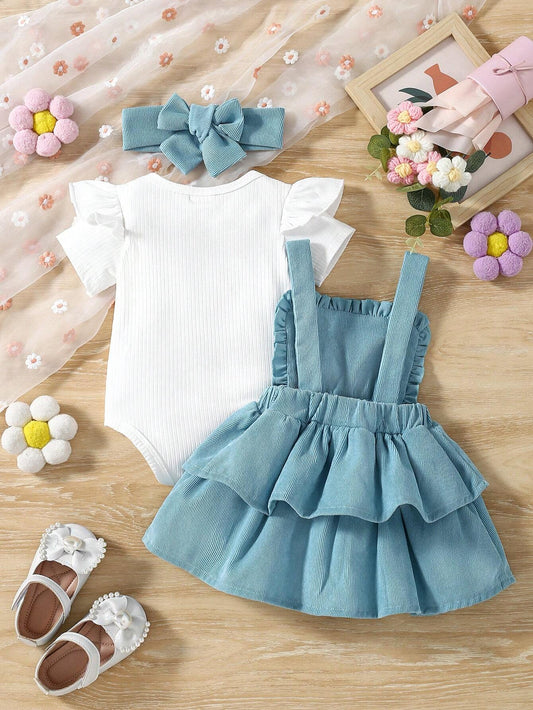 Prenda azul conjunto para bebe con volantes y tirantes vista trasera

