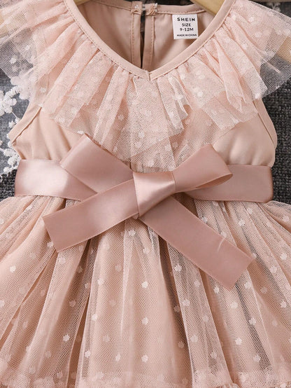 Prenda albaricoque vestido para bebe con detalle de lazo satinado y tul con lunares