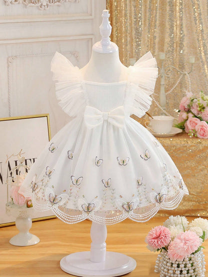 Prenda blanco vestido para bebe con mariposas bordadas y tul vista frontal
