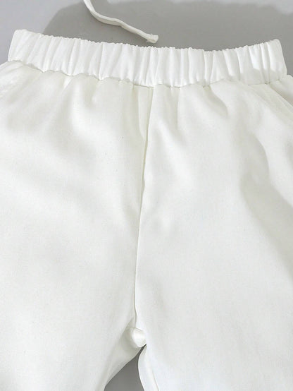 Conjunto blanco elegante para bautizo con moño