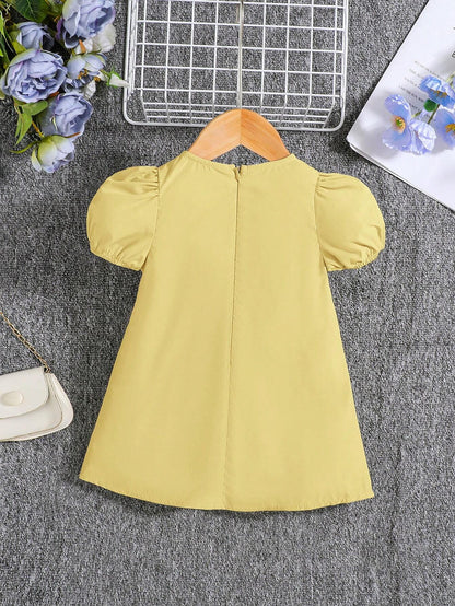 Vestido amarillo con lazos y manga farol