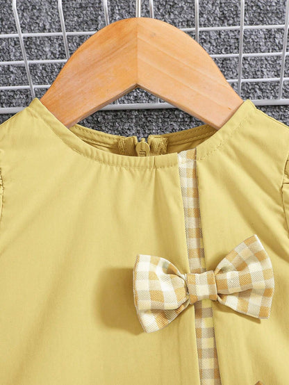 Vestido amarillo con lazos y manga farol