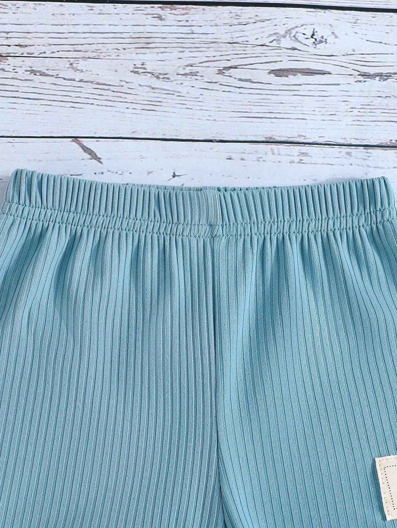 Conjunto azul sin mangas con dinosaurios para bebé niño