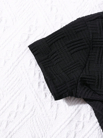 Prenda negra conjunto de camisa y shorts para bebe vista posterior