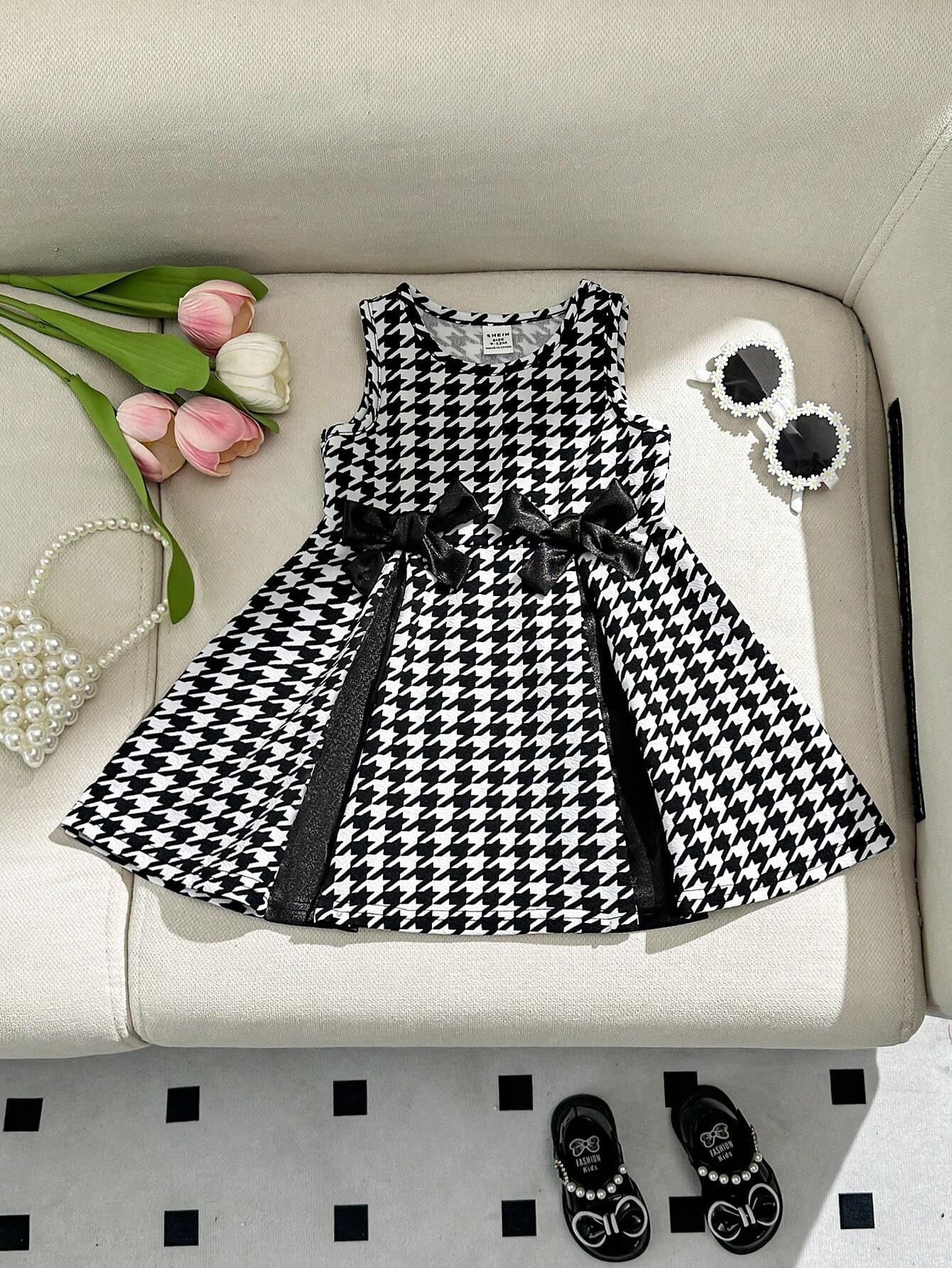 Prenda negro vestido para bebe con lazo frontal vista frontal
