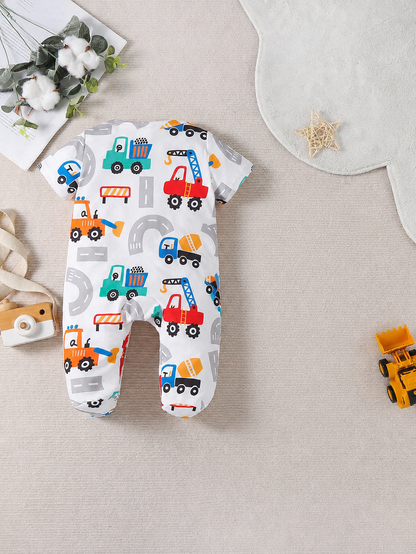 Prenda blanco mameluco para bebe con vehículos de construcción detalle frontal