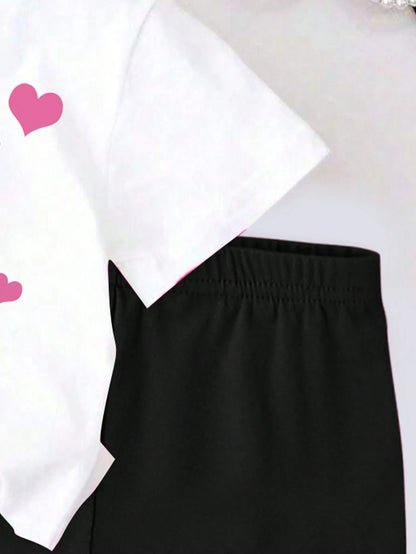 Conjunto blanco con gato y shorts negros con huellas