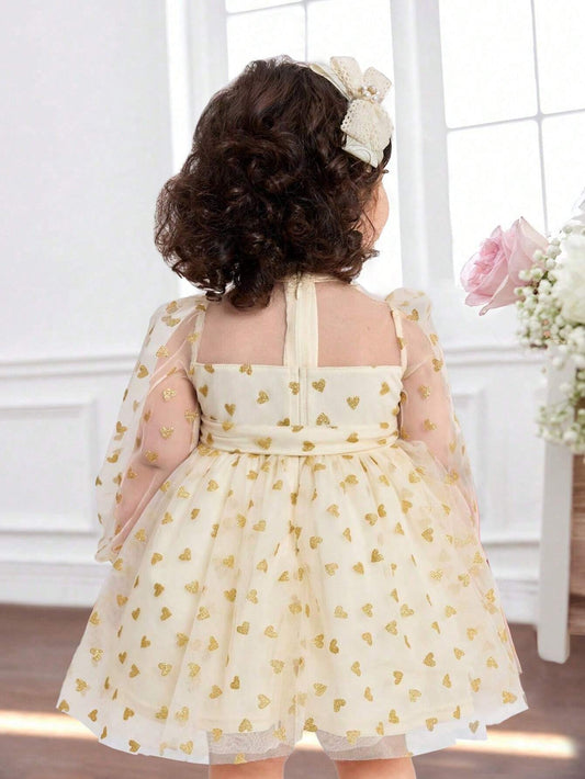 Prenda champán vestido de tul para bebe con corazones dorados vista trasera

