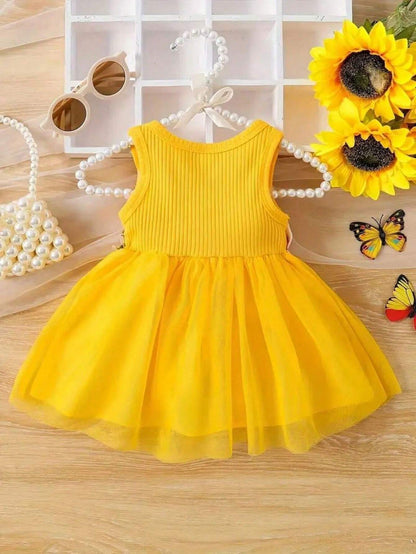 Prenda amarilla vestido para bebe de tul vista trasera
