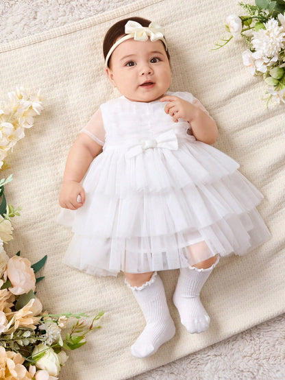 Vestido blanco elegante de malla con lazo