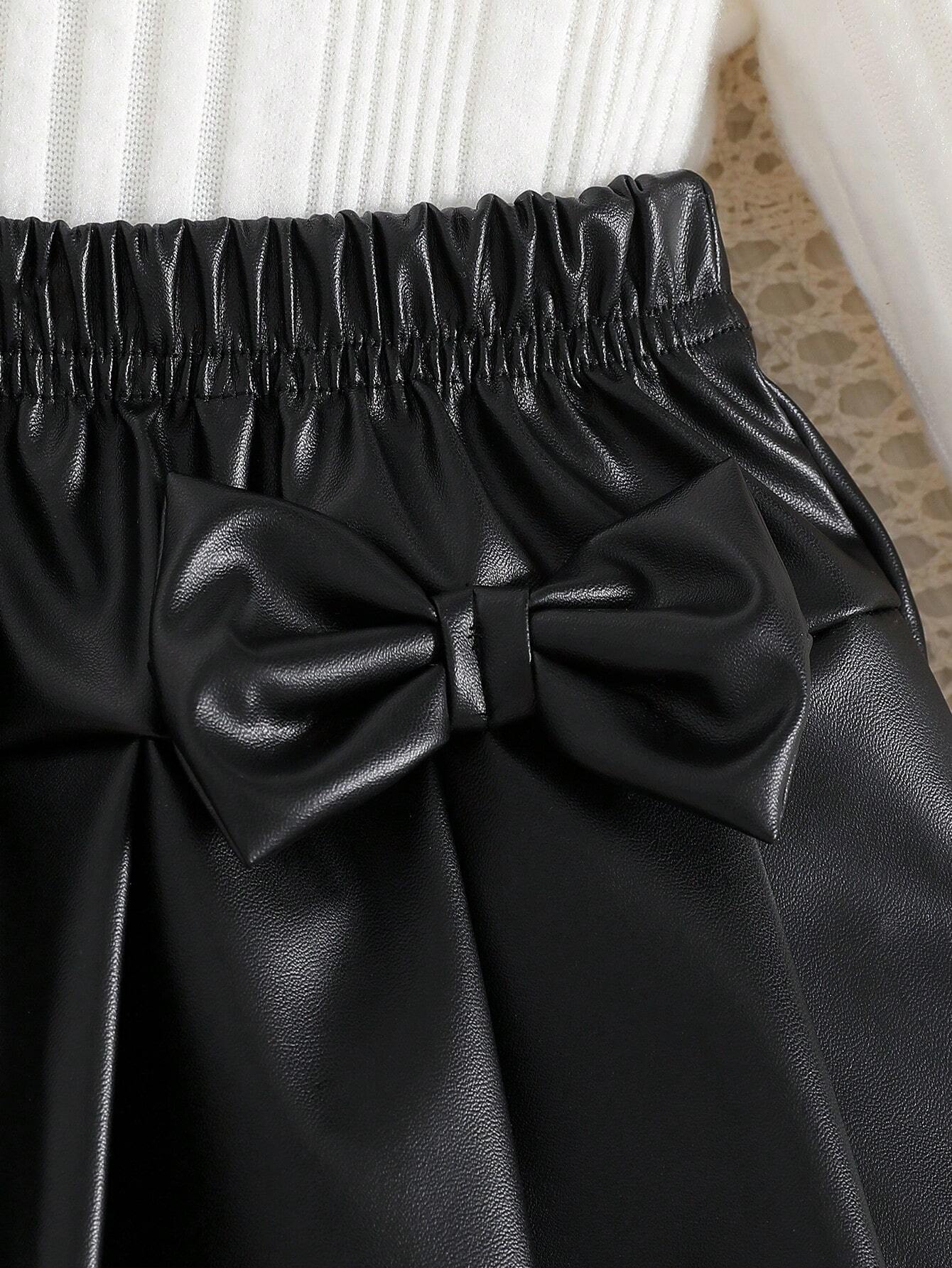 Prenda negro falda plisada para bebe con lazos decorativos