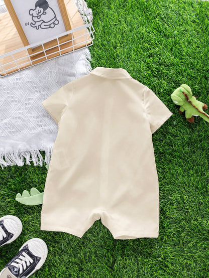 Enterizo beige verde con dinosaurio grande frontal