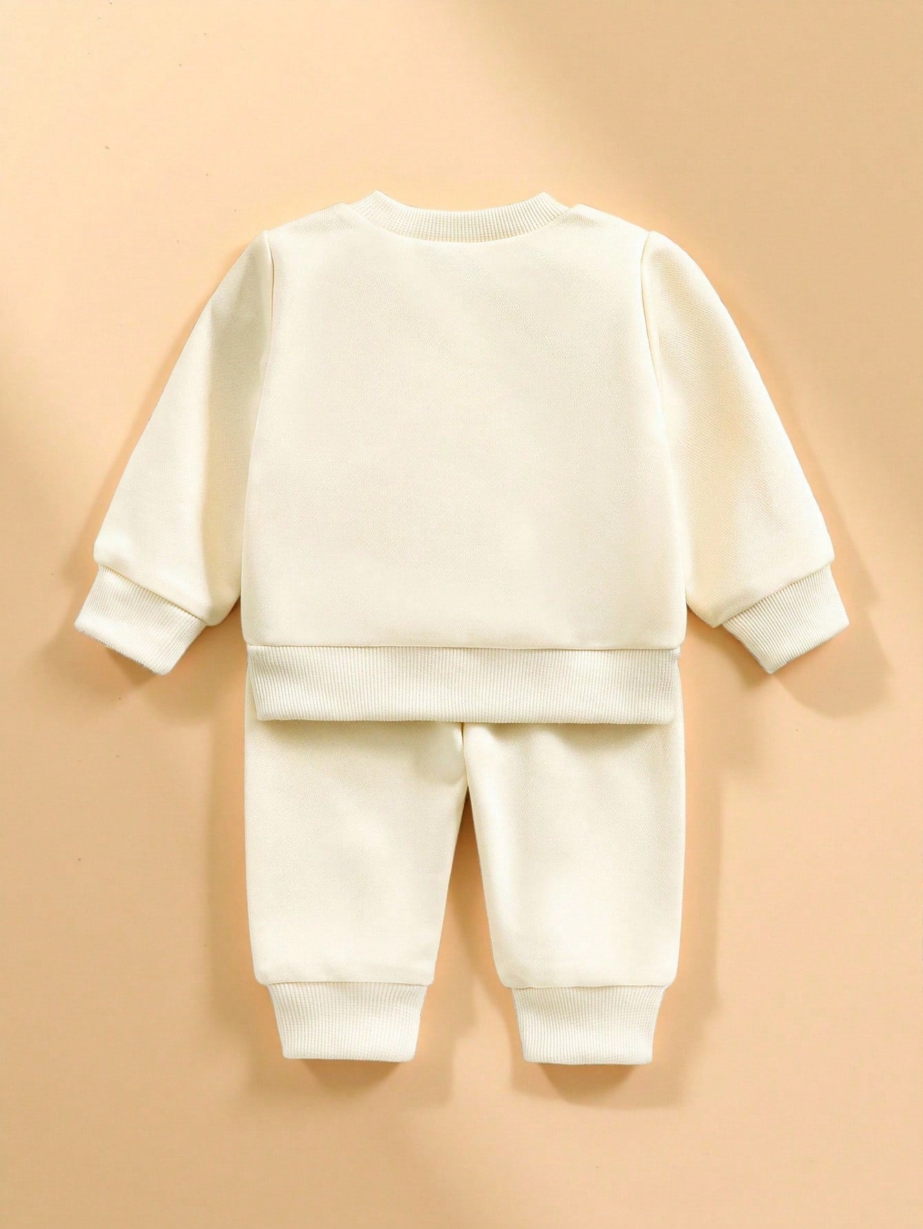 Prenda albaricoque conjunto de sudadera y pantalón para bebe vista posterior