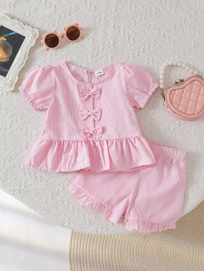 Set rosa con moños y shorts con volantes