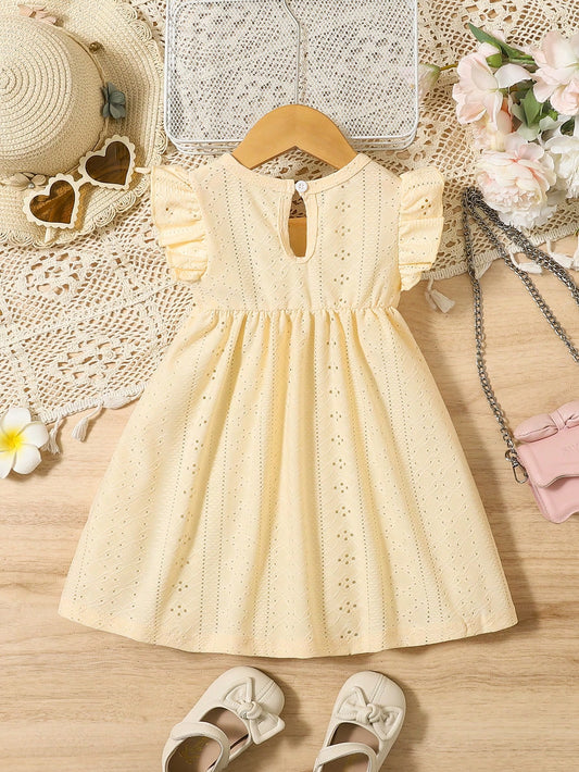 Vestido amarillo con volantes y cuello redondo