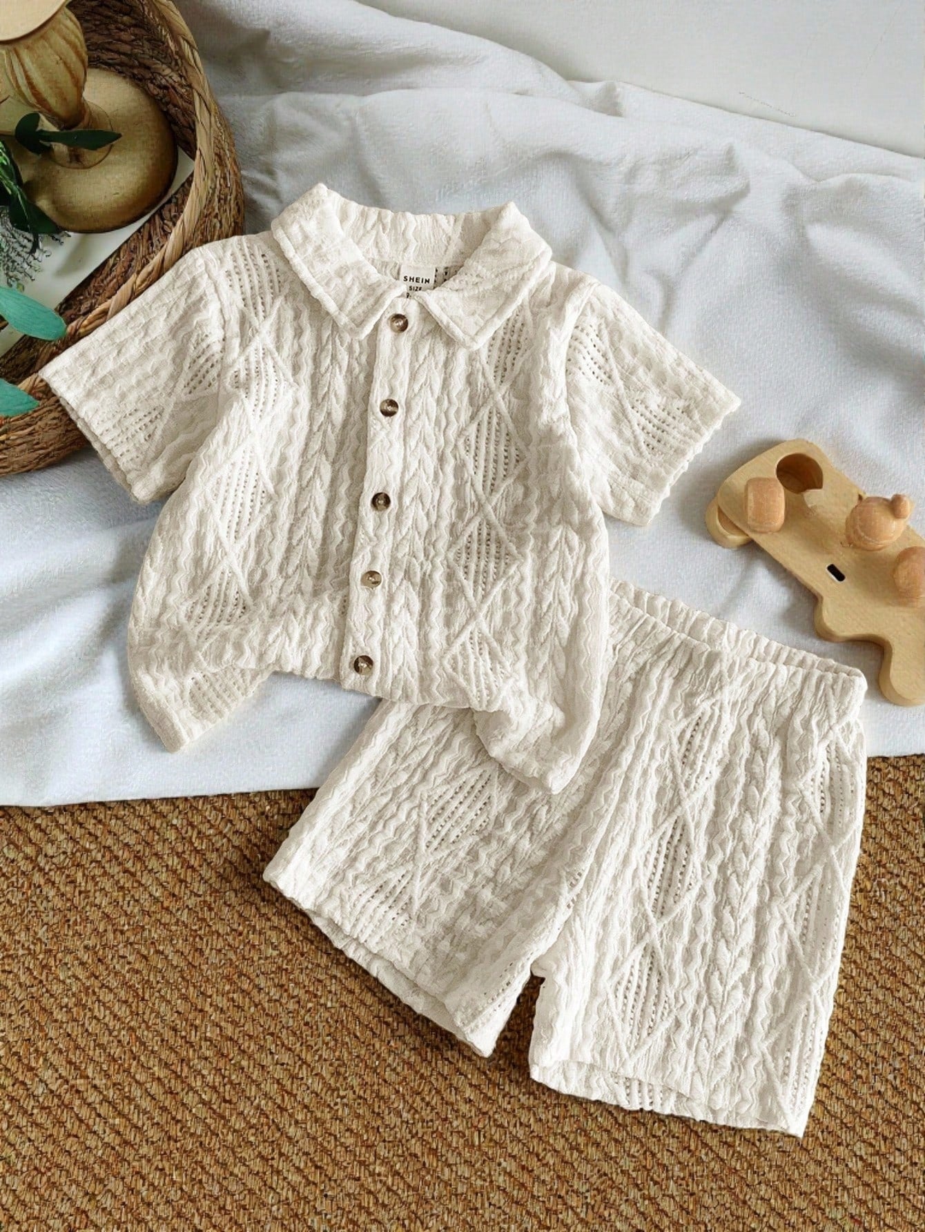 Prenda albaricoque conjunto de ropa para bebe camisa texturizada y shorts vista frontal