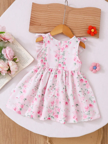 Vestido floral rosa con volantes y lazo